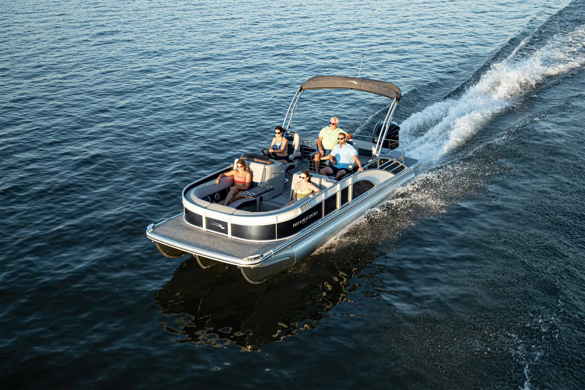 Pontoon boat cruising on open water