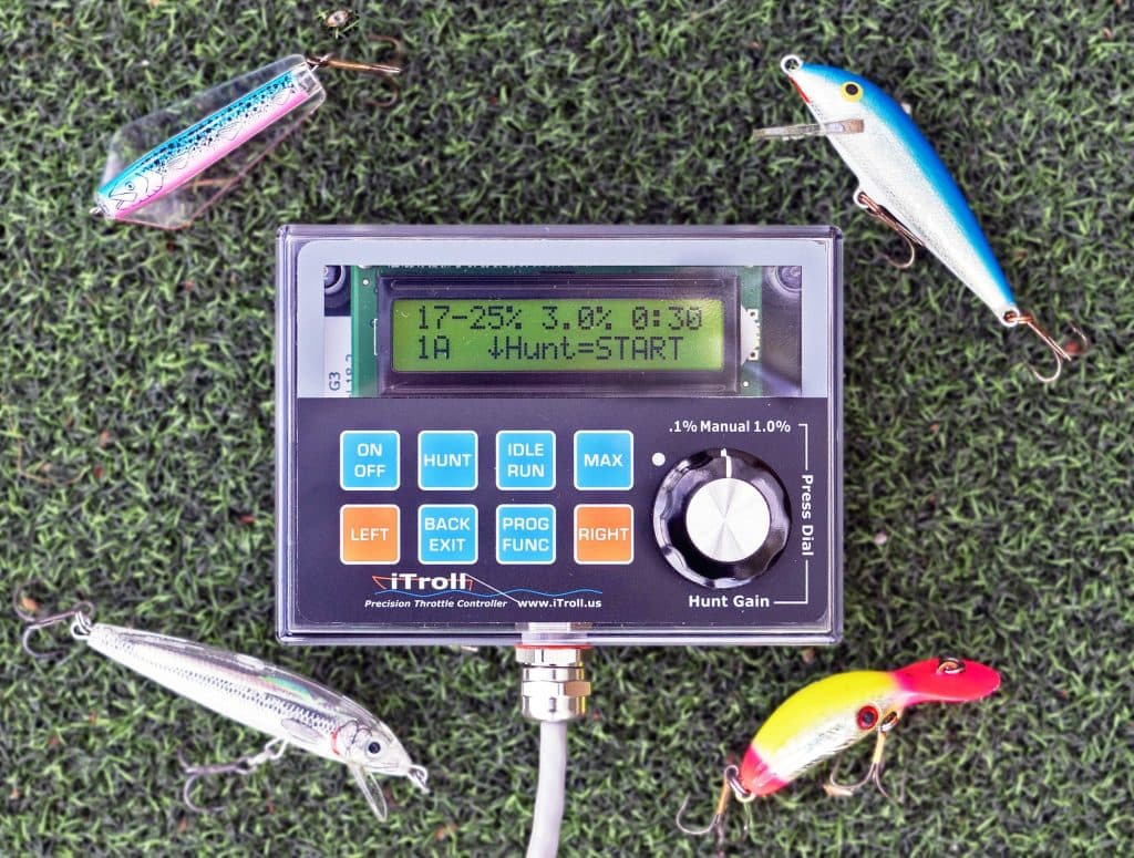 iTroll G3 precision throttle controller surrounded by fishing lures